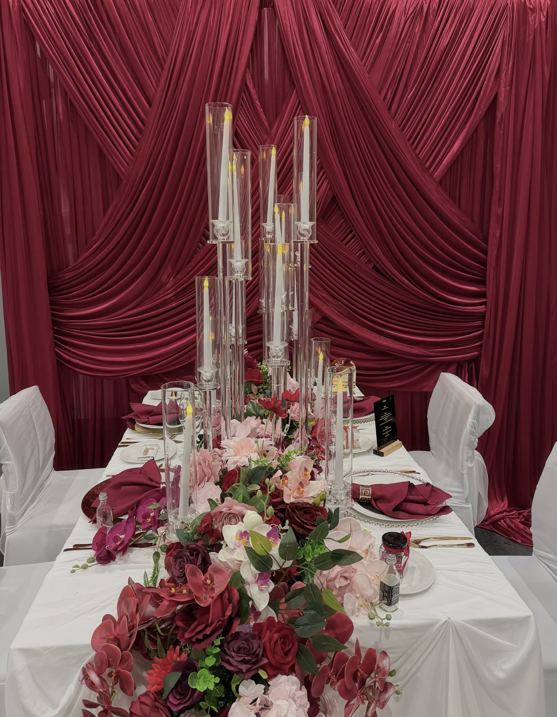 Burgundy drape and crystal candle table styling
