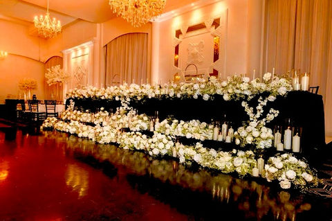 Wedding table with tall candles and glassware