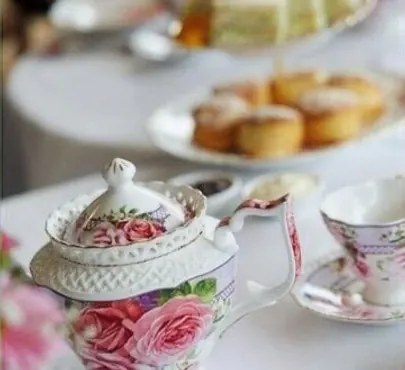 Vintage high tea teapot and cup set with small desserts