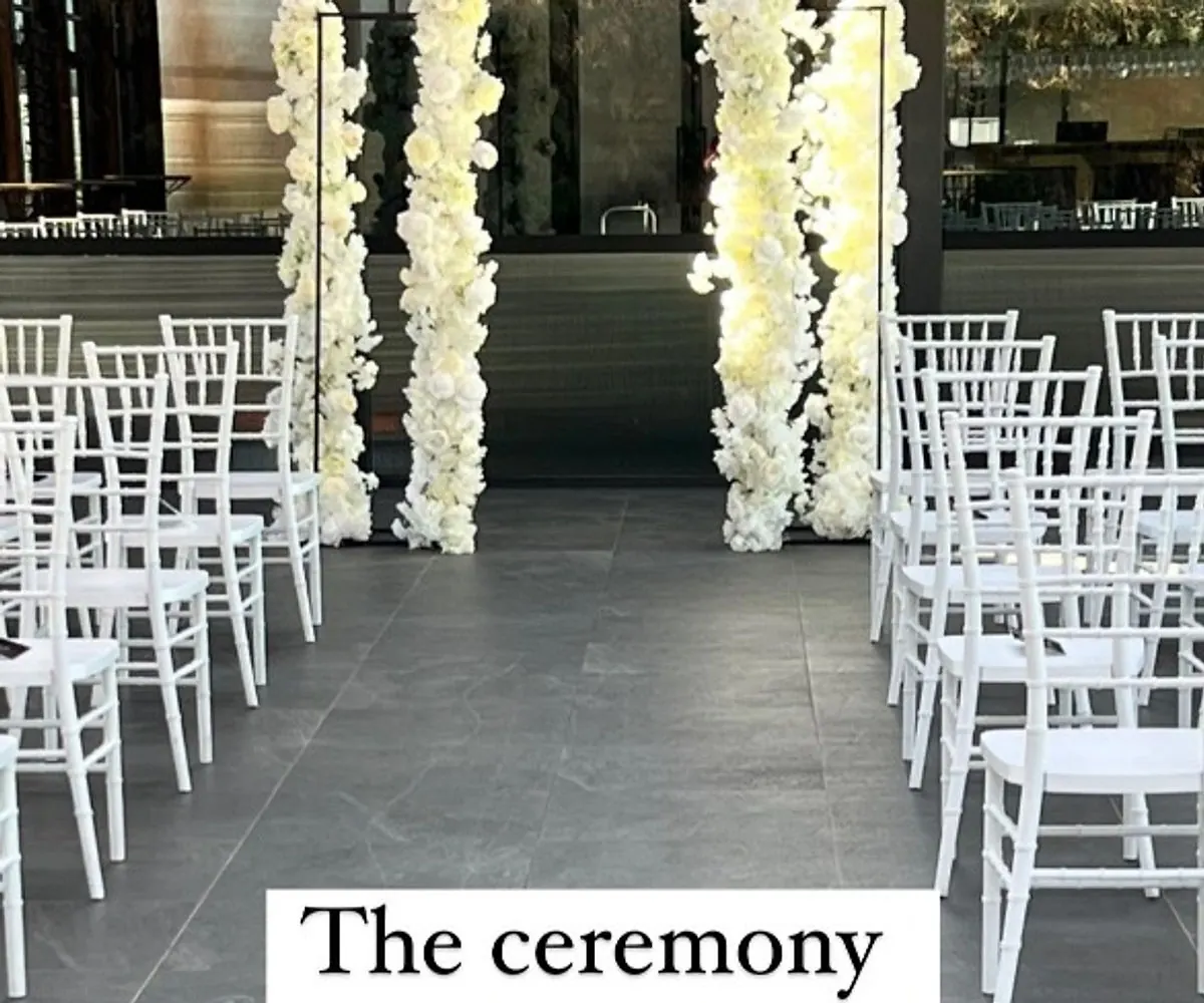 Gold plinths and white flowers