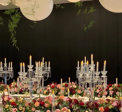 Crystal candelabras styled on a floral wedding reception table