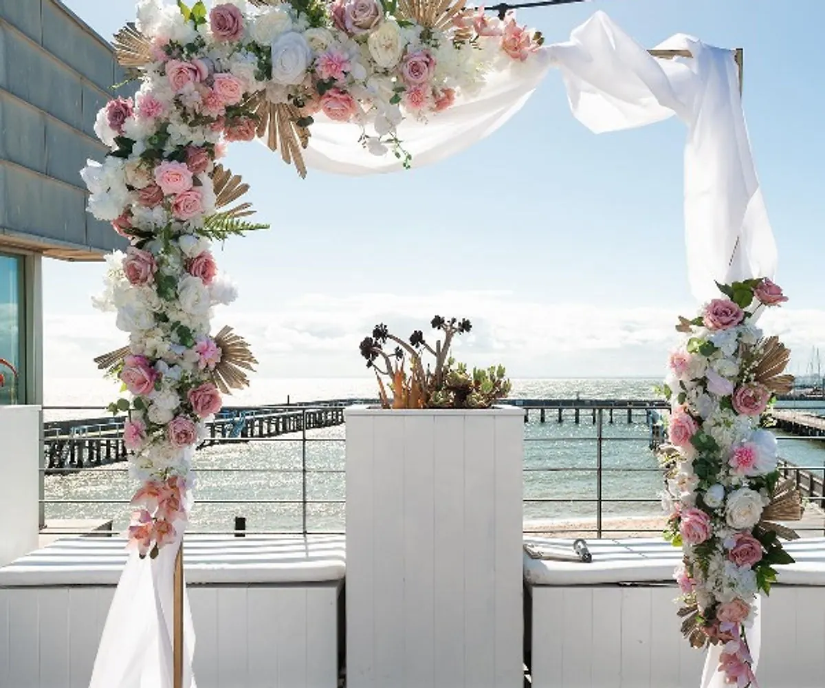 Square ceremony arch with flowers