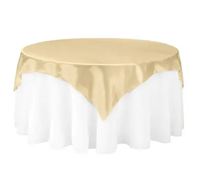 Gold satin table overlay on a round table for event hire