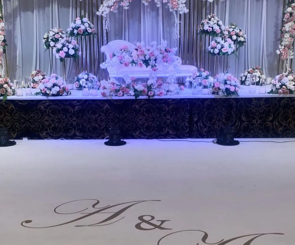 golden arch bridal stage