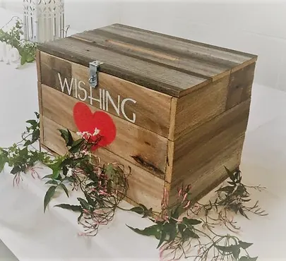 Glass wishing well for wedding cards on a styled reception table