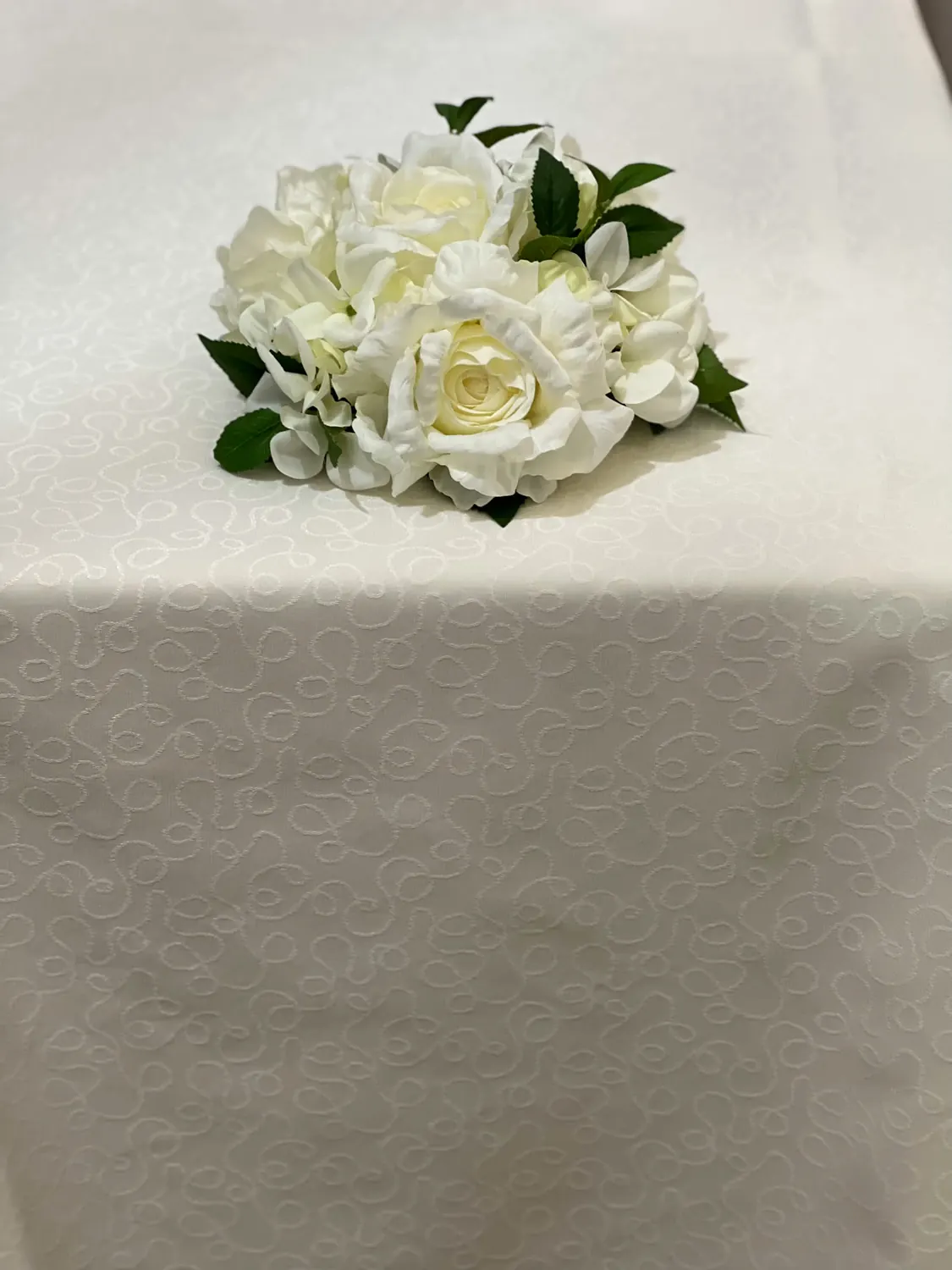 Ivory patterned tablecloth with white floral detail